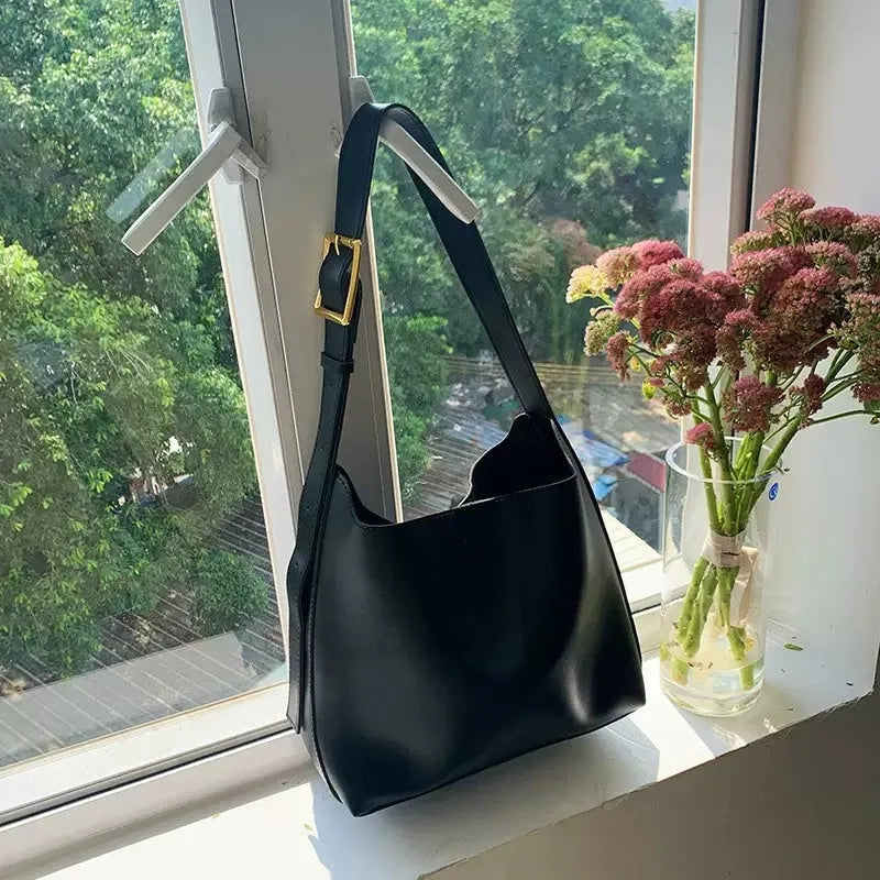 Women's black PU leather shoulder bag with swing thread design and adjustable strap