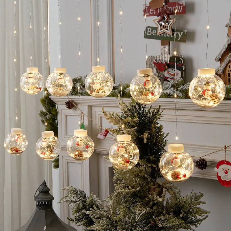 LED Christmas curtain lights with 10 fairy wishing ball lamps showing snowman, Christmas tree and elder designs