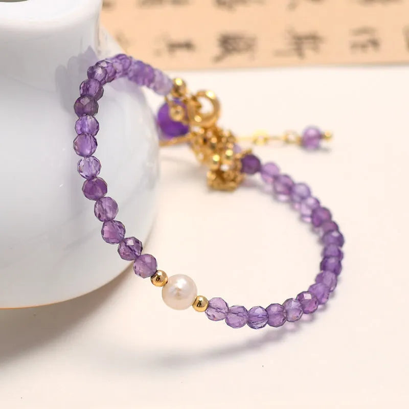 Chinese style women's bracelet with amethyst crystal stones in diamond cut on electroplated metal band
