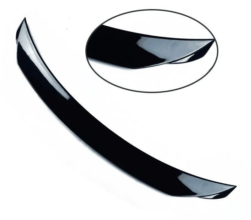 Bright black Mazda 3 Axela Exela tail trim for 2014-2021 models showing sports tail blade design