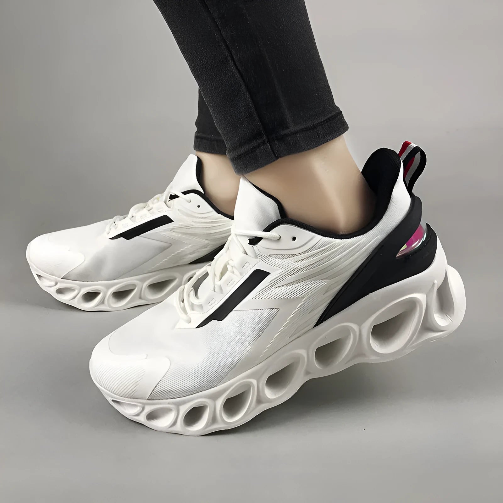 Men's black breathable low-top casual sports shoes with mesh upper and white EVA sole on a plain background.
