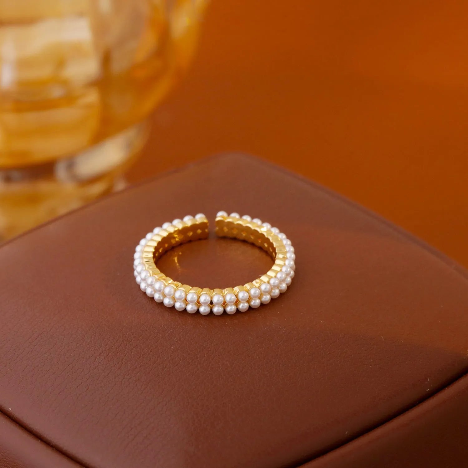 Gold geometric open mouth women's ring with pearl elements on electroplated copper