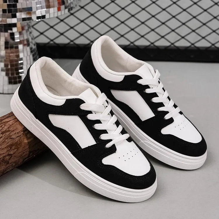 Black women's rubber casual sports shoes with flat heel, low top, round toe, and front lace-up closure