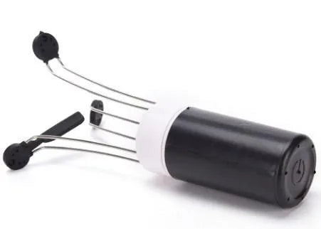 White and black wireless stir crazy mixer with stainless steel shaft on a kitchen countertop