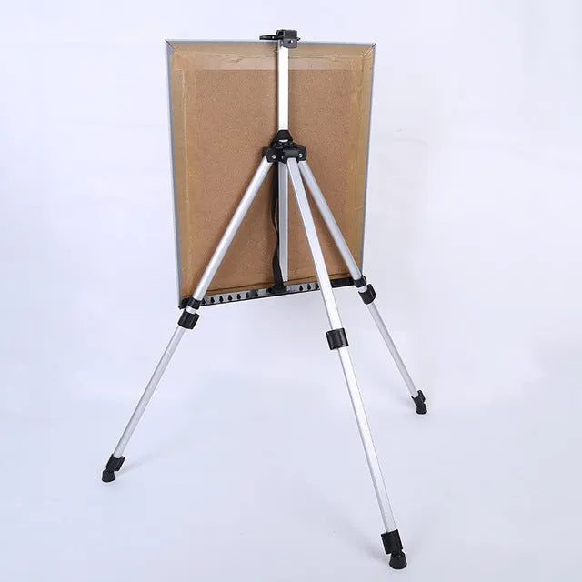 Silver adjustable aluminium alloy easel folded for transport with black carrying bag and shoulder strap
