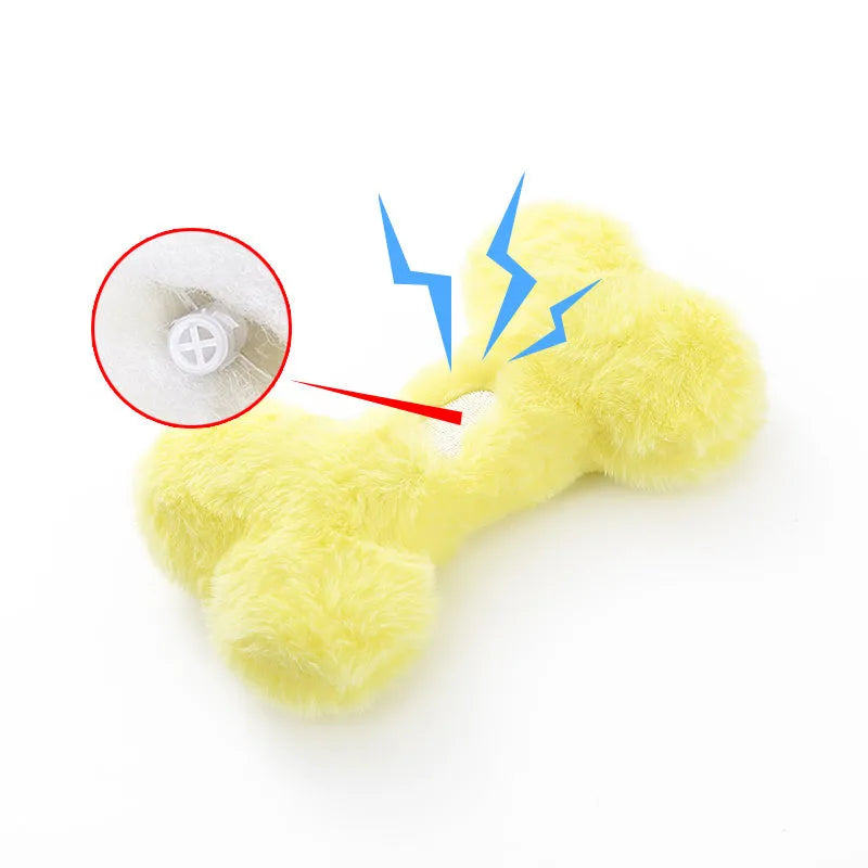 Blue pink and yellow plush bone dog toy with a textured grinding teeth surface.