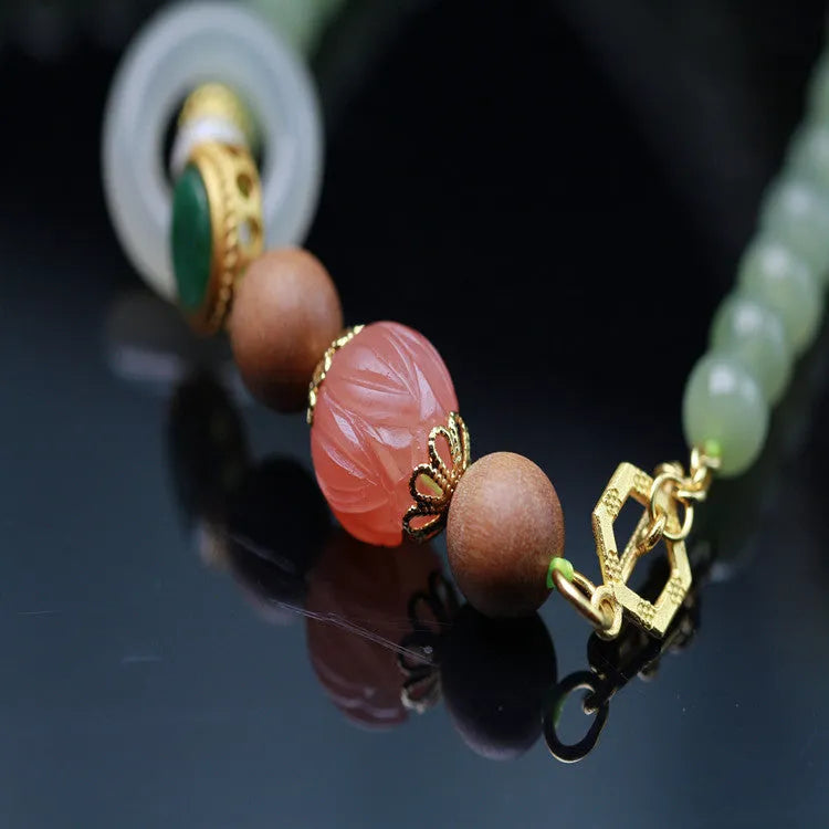 Natural Hetian jade necklace with red lotus, white sandalwood, and beeswax beads, unisex style with fu character motif