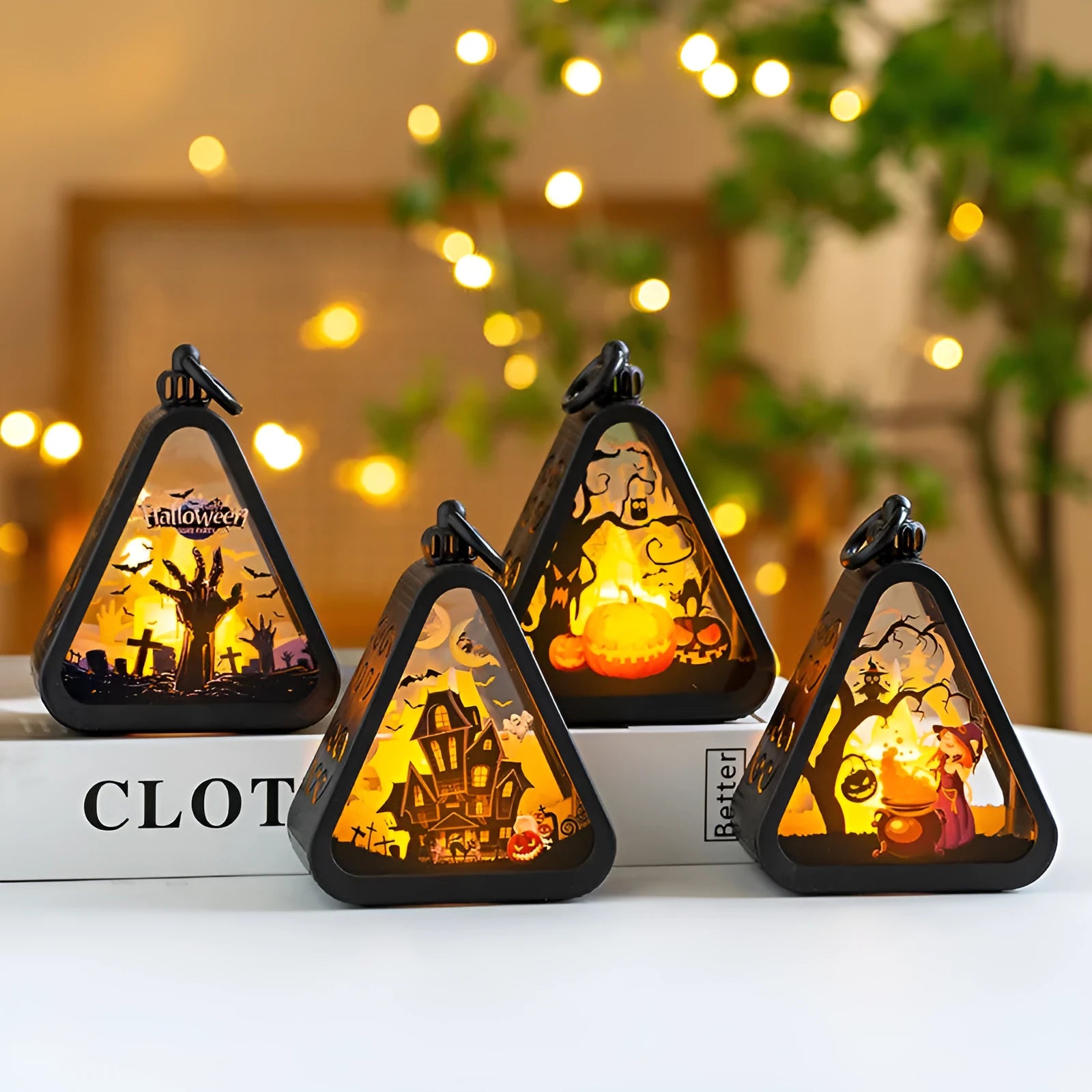 Halloween pumpkin lantern decoration with battery-powered light in one of four colour designs