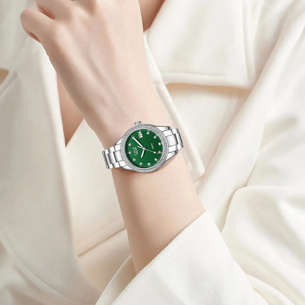 Women's silver tone quartz watch with diamond-encrusted bezel and luminous dial