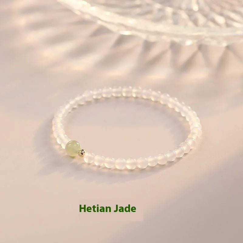 Natural Hetian Jade white agate women's bracelet 15cm on display showing banded white stones