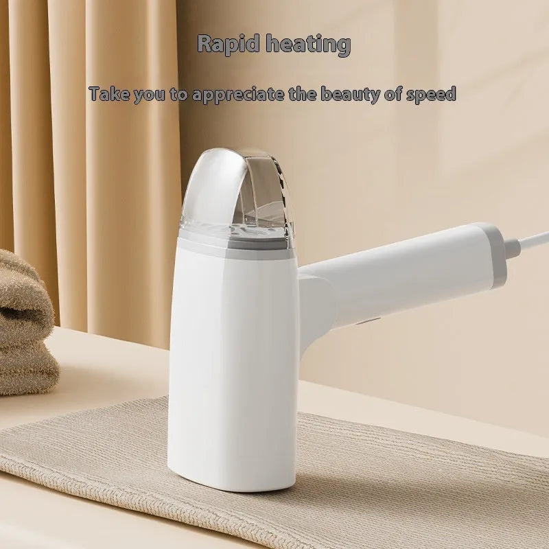 Blue and white handheld garment steamer with temperature control dial and compact 196mm design