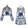 Women's floral print polyester co-ord set with long sleeves and a long skirt on a hanger.