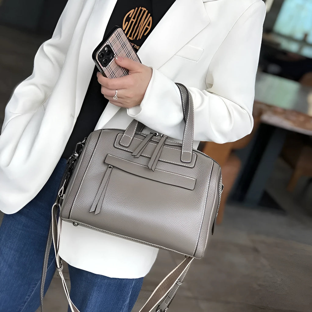 Genuine leather shoulder messenger bag with litchi pattern texture in a horizontal square shape.