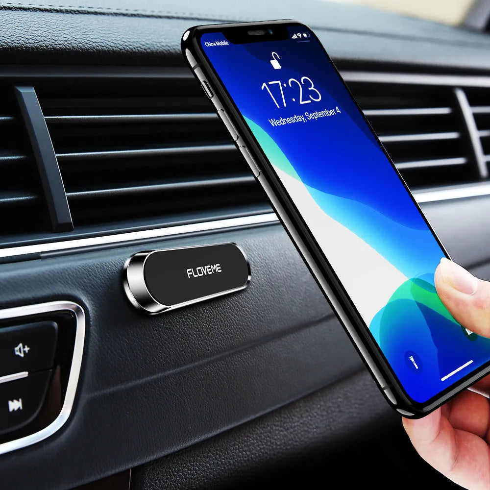 Black magnetic car and home mobile phone holder with silver iron sheet and white foam glue.
