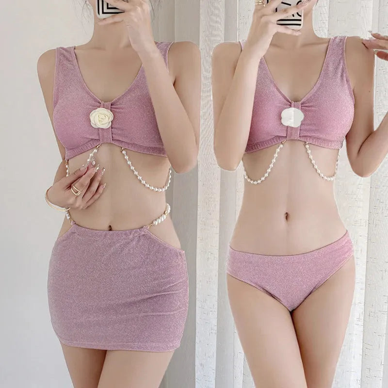 Women's pink and black three-piece polyester bikini swimsuit for swimming.