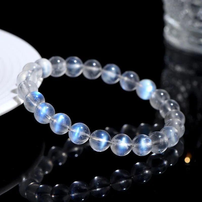Natural cream body crystal blue moonlight bracelet showing polished finish on a simple band.