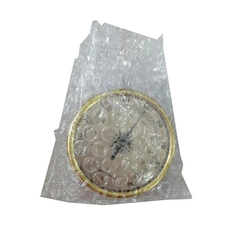 Analogue thermometer and hygrometer with aluminium ring and dial showing temperature and humidity readings