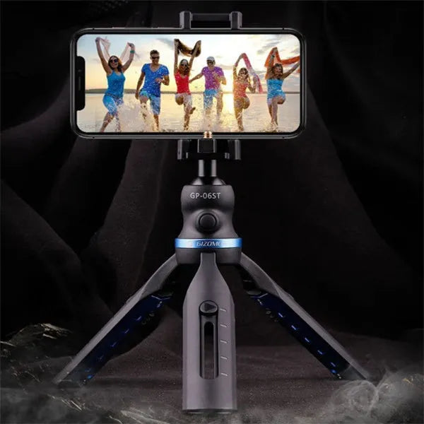 Black desktop phone tripod stand compatible with iPhone models on a desk