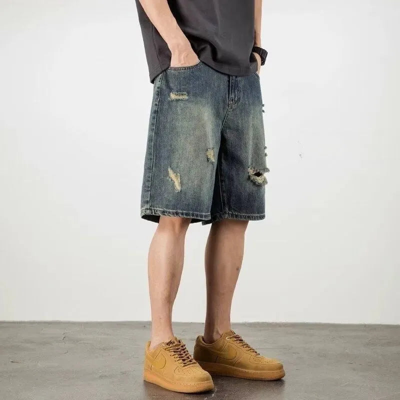 Men's blue denim shorts with loose hole retro styling and straight cut design