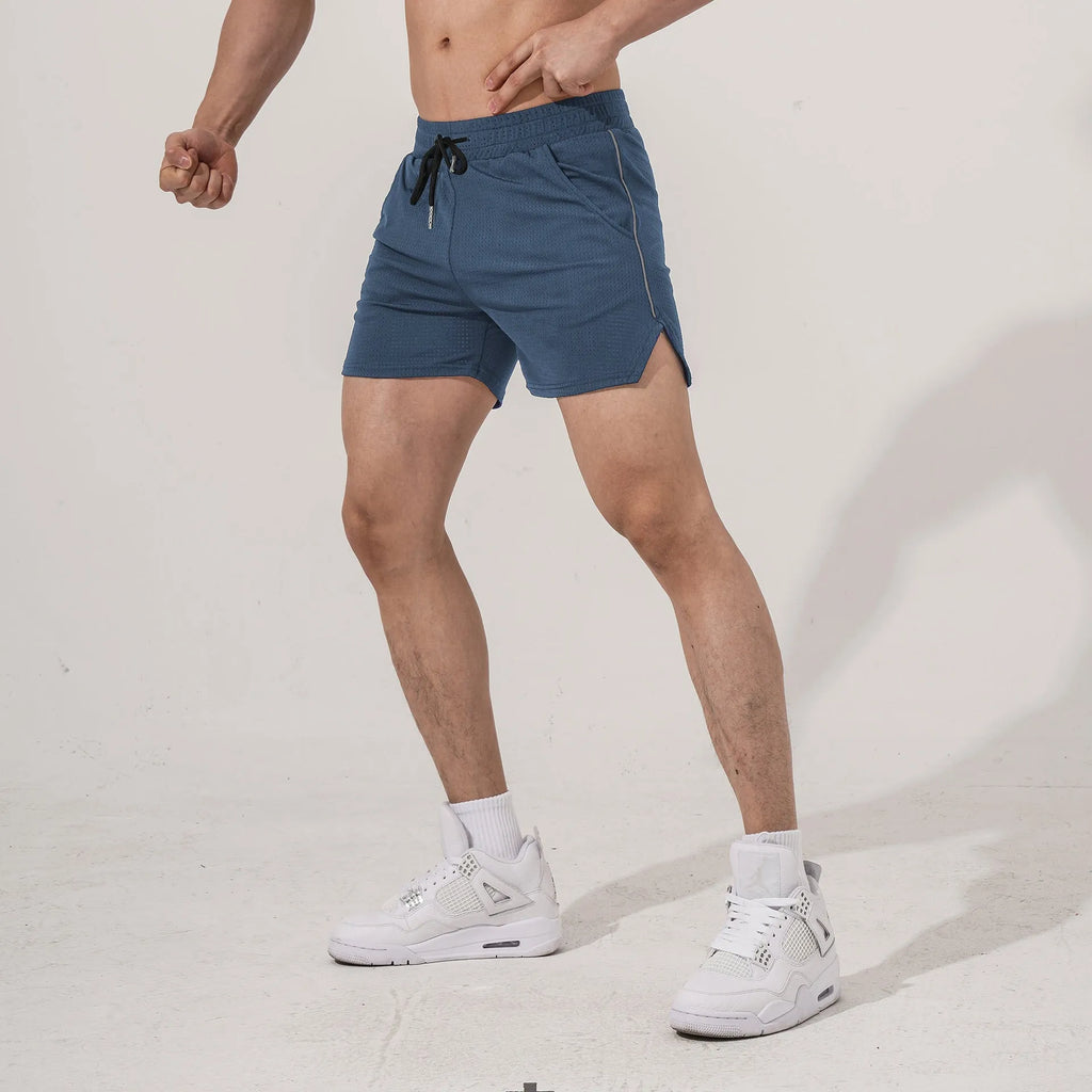 Man wearing straight-leg black polyester sports shorts suitable for fitness or casual wear.