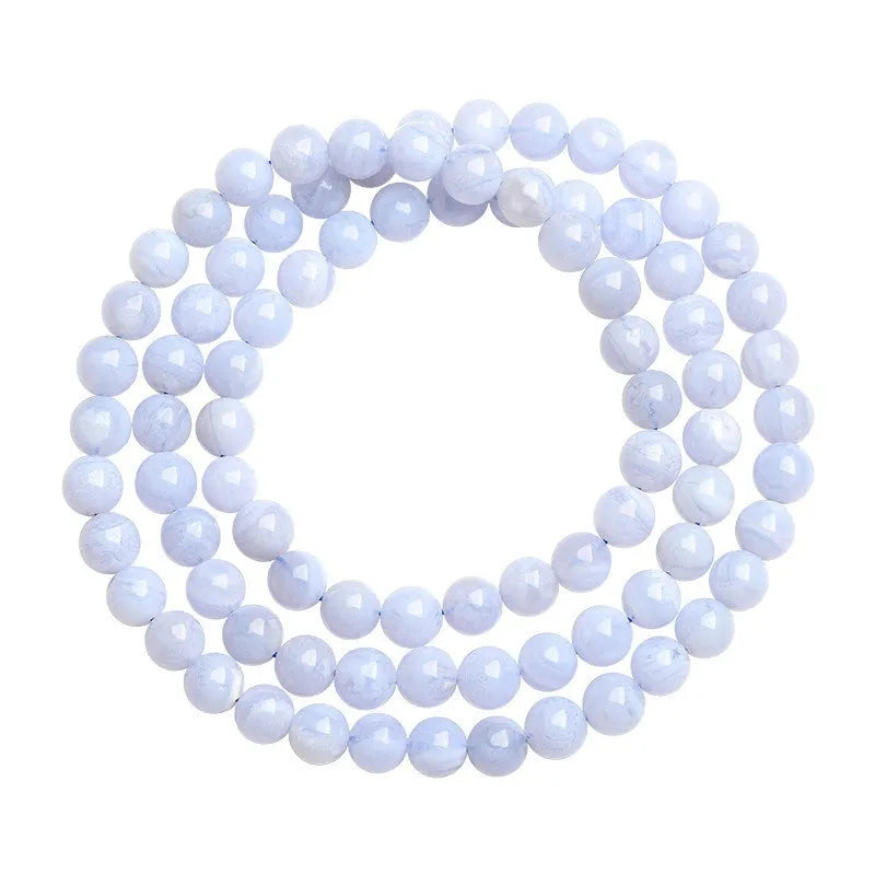 Blue agate multi-circle pattern bead bracelet with original design on a wrist