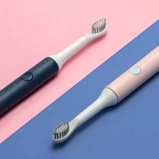 Sonic electric toothbrush with round brush head in blue, IPX7 waterproof handle with power button