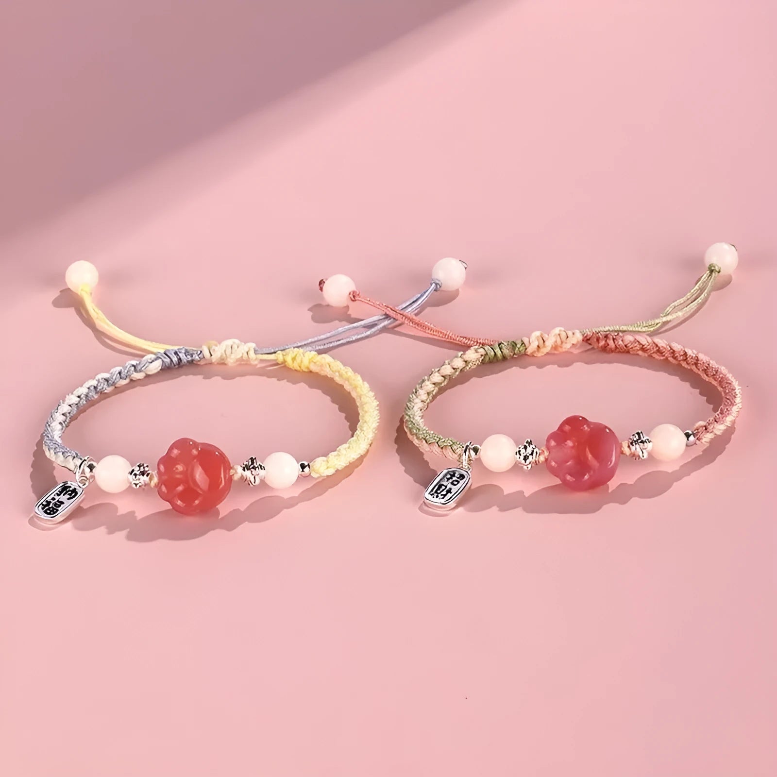 Handmade glass and coloured glaze cat's paw woven bracelet for couples in red, pink, or yellow