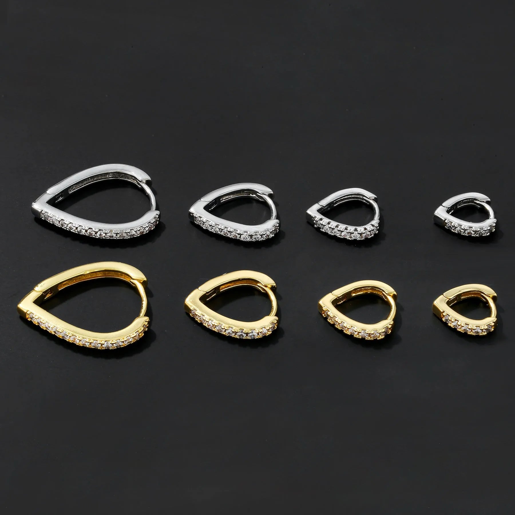 Copper geometric heart-shaped clip-on earring in a gold tone finish on a white background.