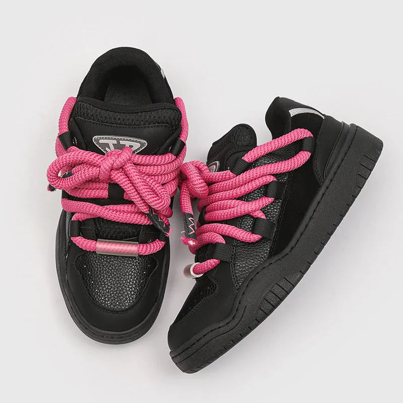 A pair of low-top unisex casual shoes with a round toe, thick rubber sole, and lace-up front on a white background.