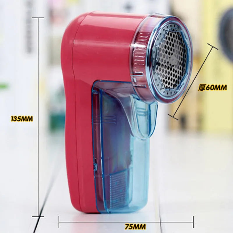 Handheld portable electric lint and pill remover for sweaters on a blue background.
