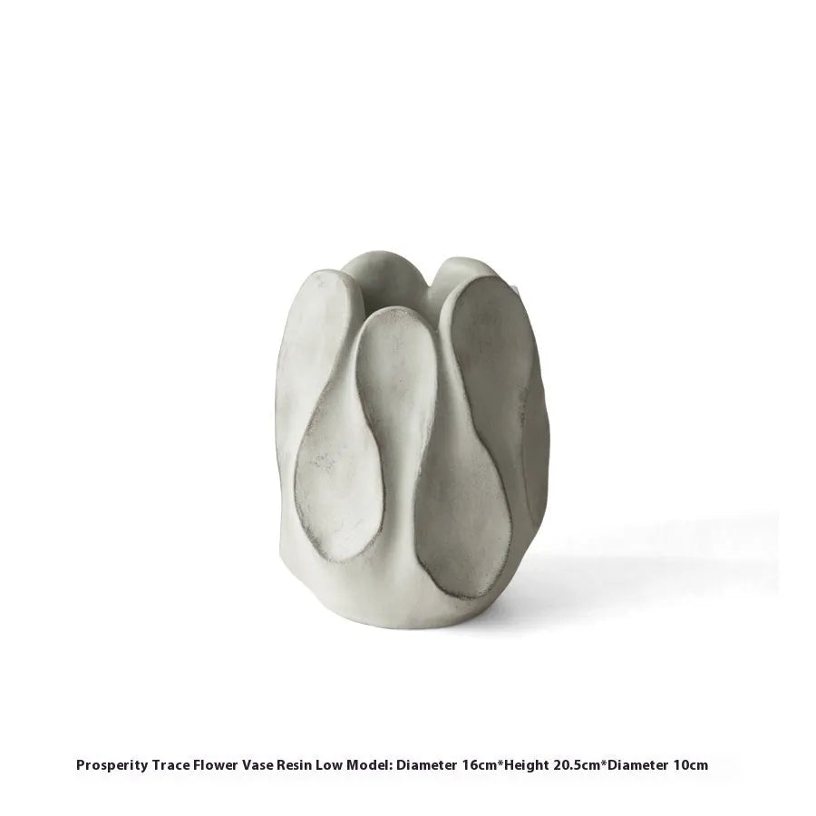 Handmade irregular ceramic vase in magnesium clay, shown in high and low style options.