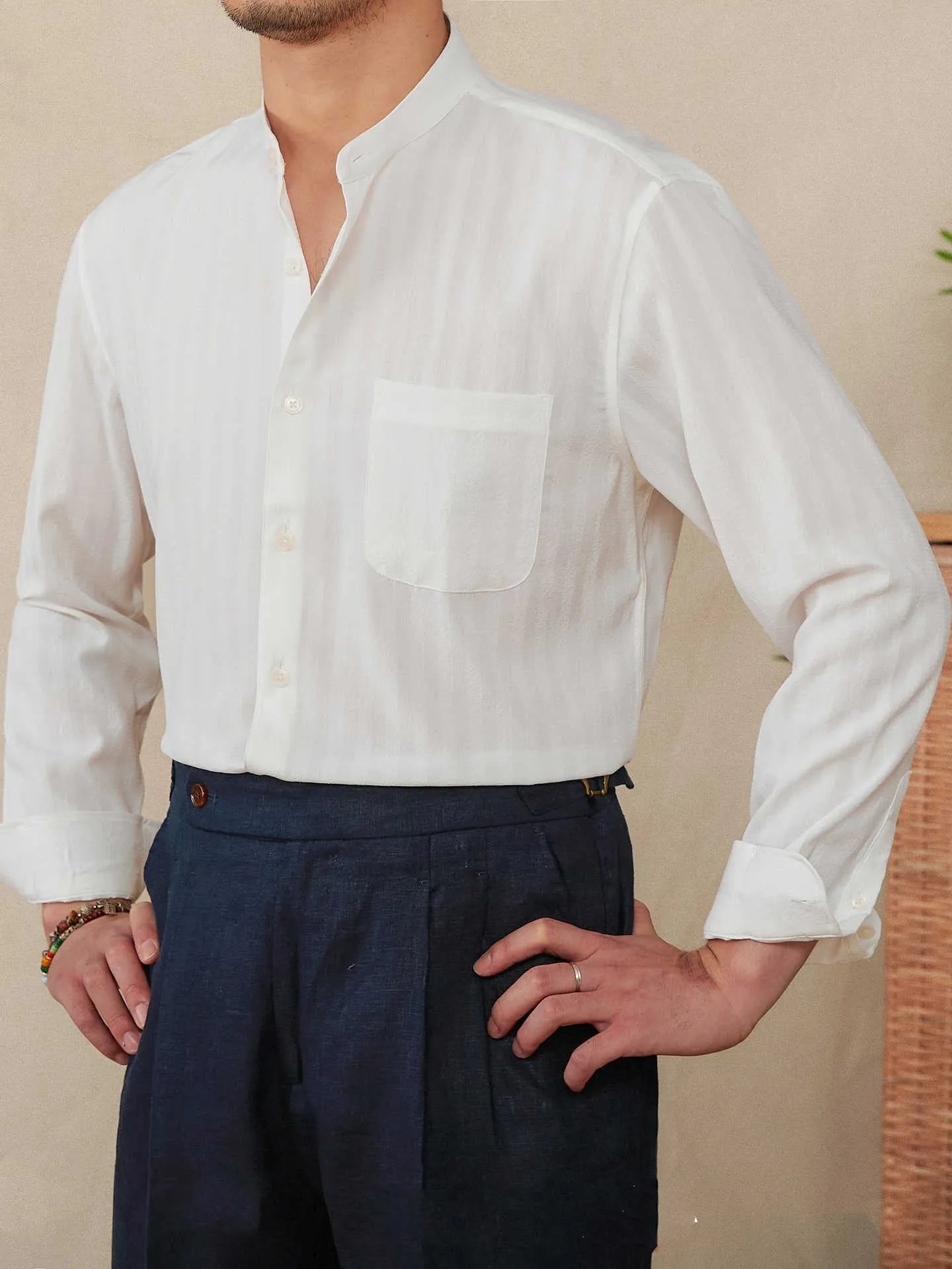 Loose fit seersucker striped long sleeve shirt with baseball collar in blue colour, front view on white background