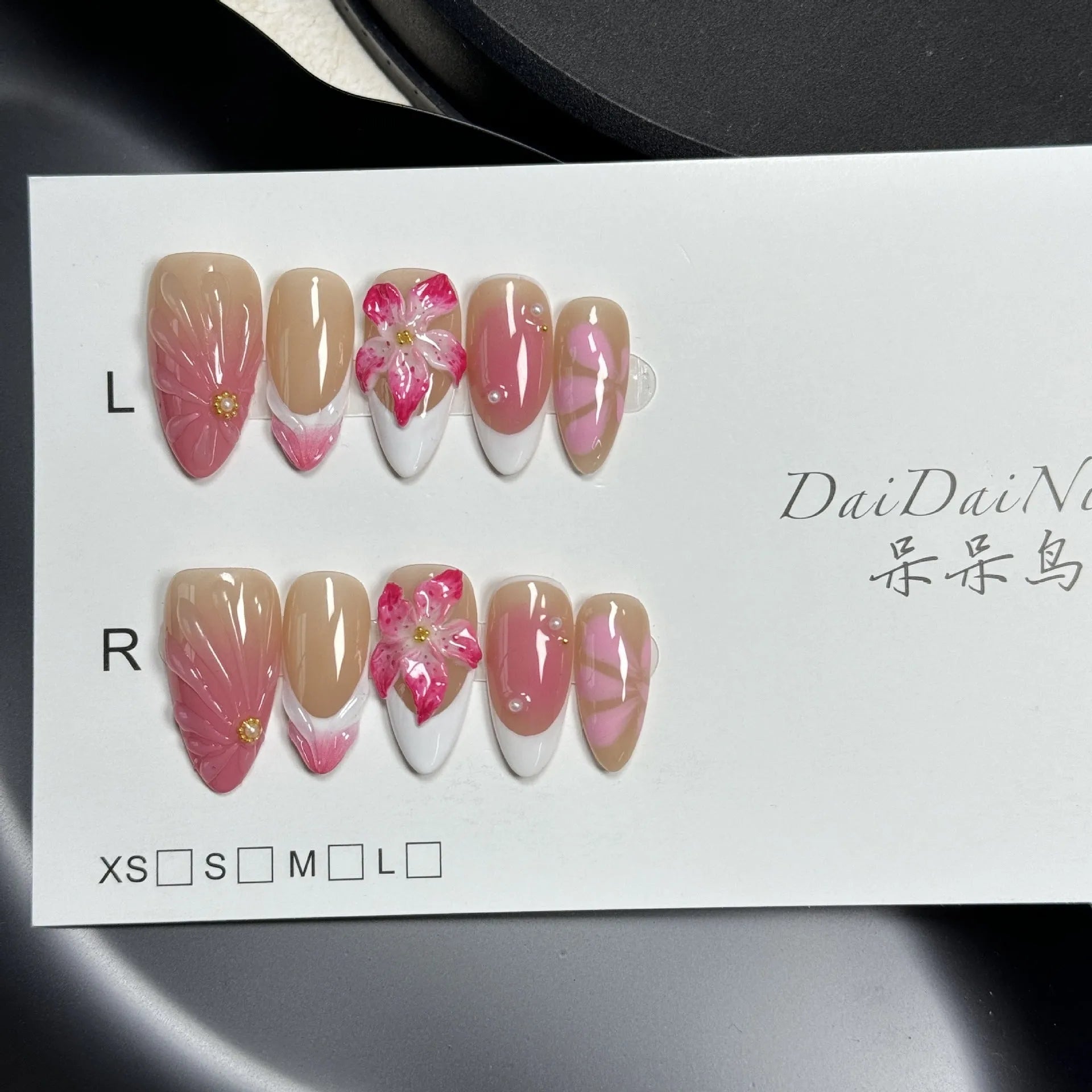French style Lily Fluid Ice Flower design 3D artificial press-on nails in almond shape, showing colour mix and size scale.