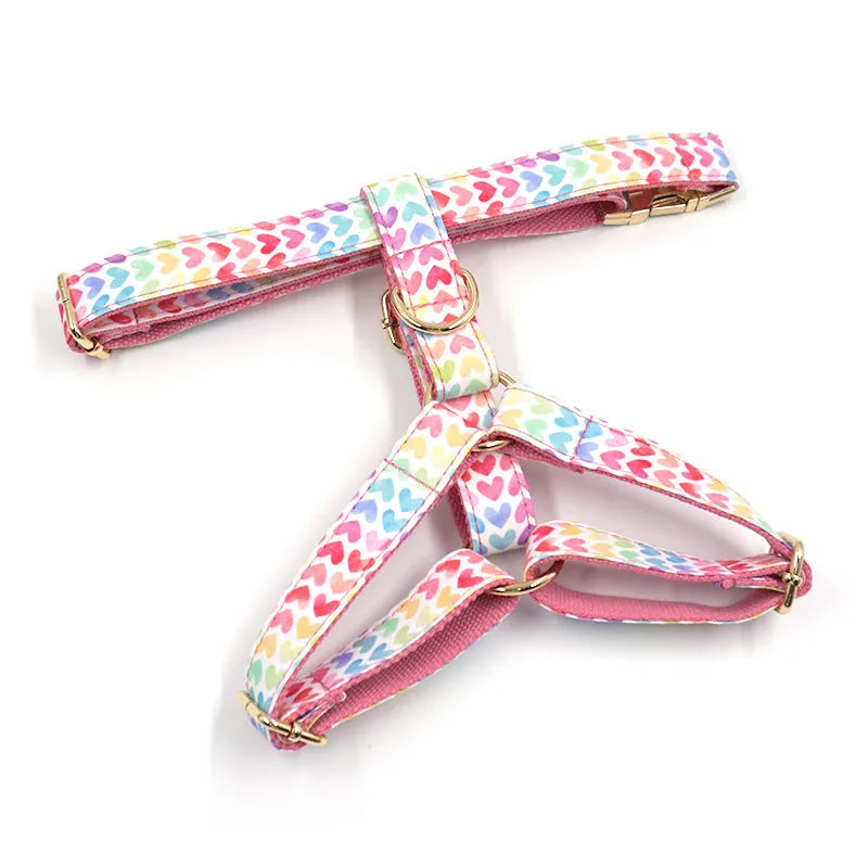 Pink colourful dog chest and back harness with gold buckle and heart-shaped stone on polyester strap