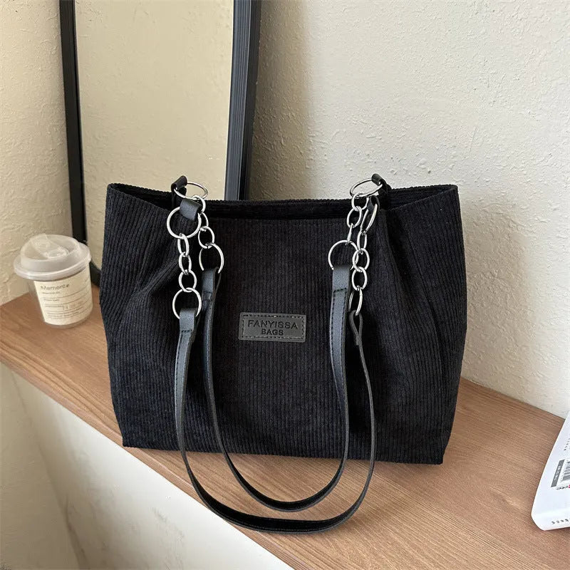 Corduroy one-shoulder tote bag in horizontal square shape with internal pockets