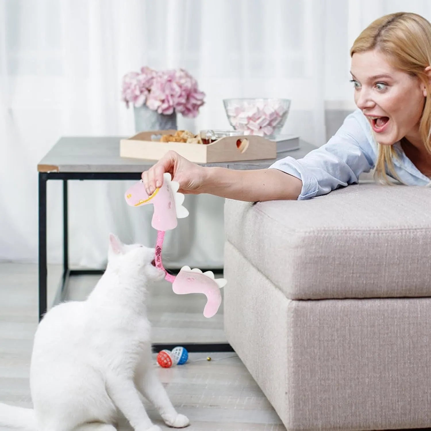 Set of four cat toys including catnip rope, springs and kicker toys in pink, purple or yellow