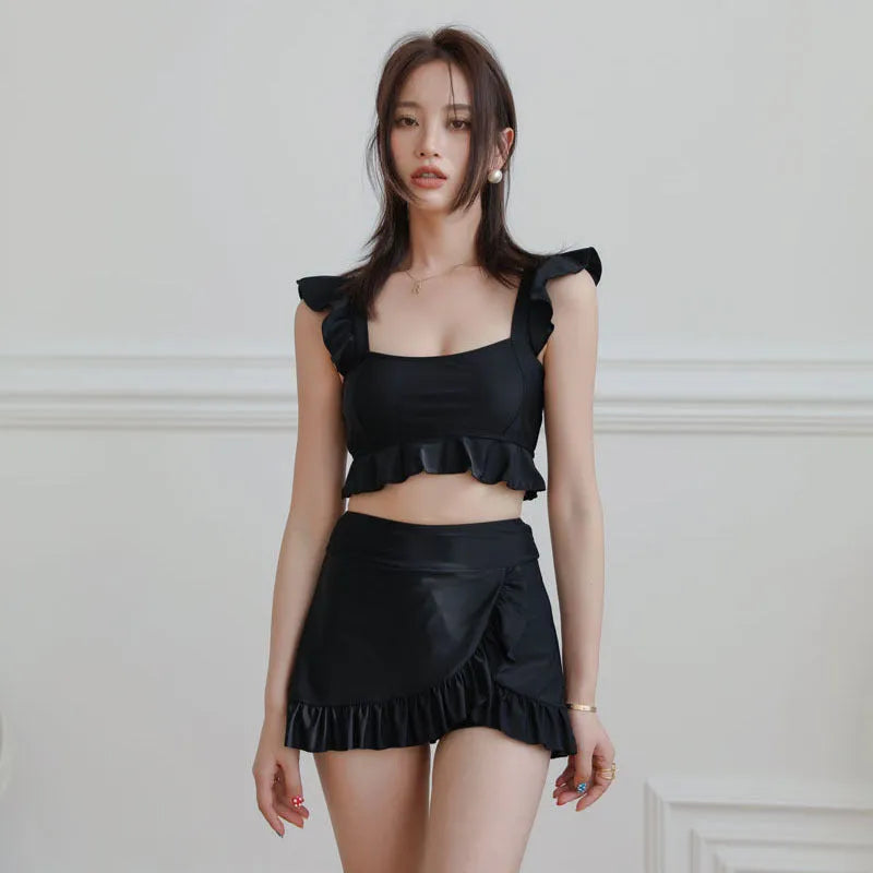 Women's black nylon split swimsuit brief style for swimming and wading flat lay
