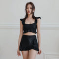 Women's black nylon split swimsuit brief style for swimming and wading flat lay