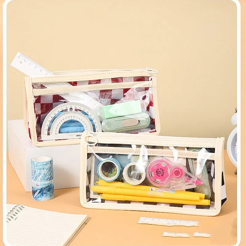 Transparent PVC pencil case with chessboard pattern showing writing instruments inside