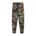 Men's grey quick-dry fitness trousers with ankle-tied design on exercise equipment