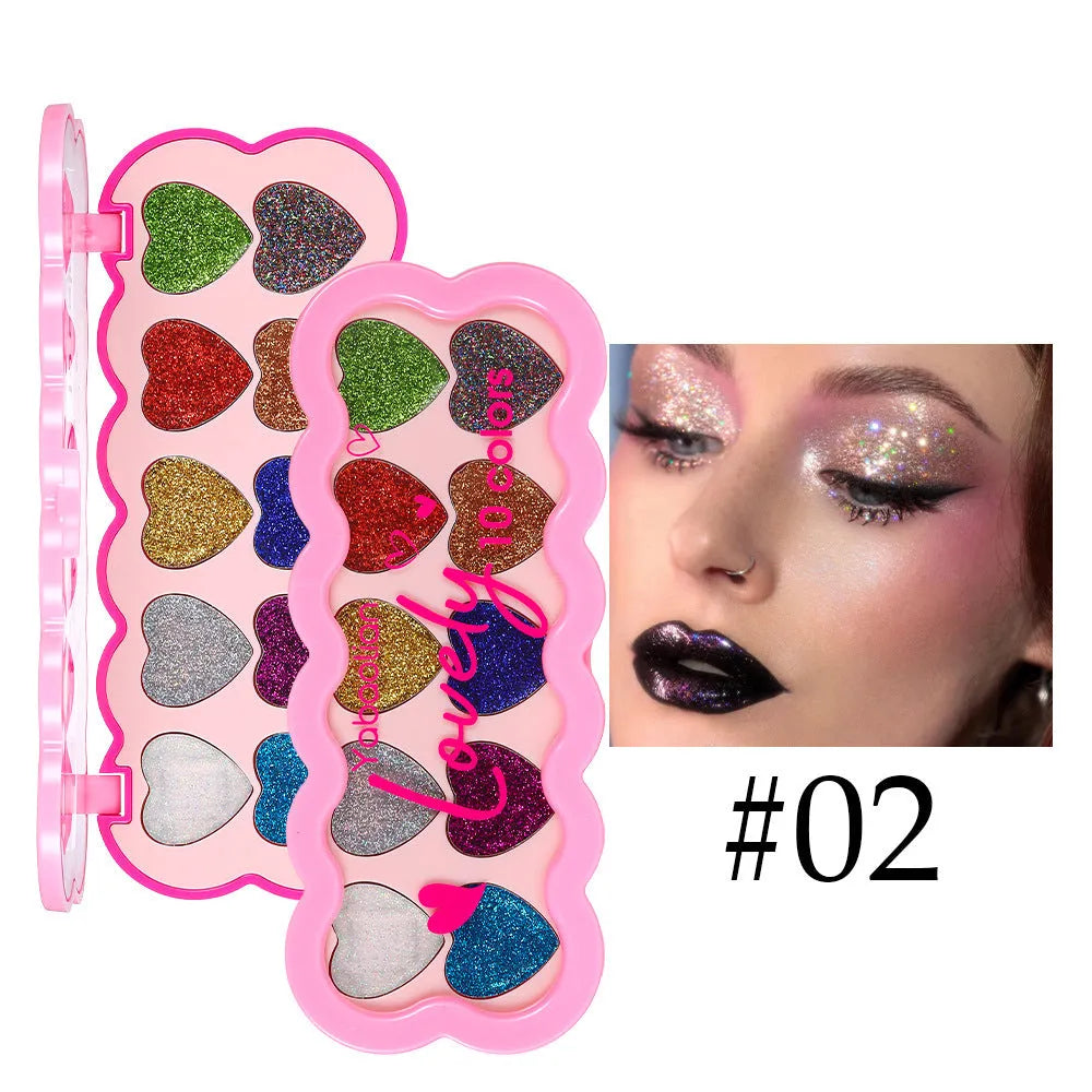 Pearlescent heart-shaped makeup palette open to show ten different coloured eyeshadows.