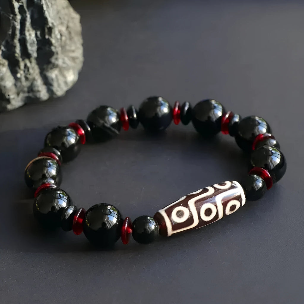 Black agate Dzi bead bracelet with geometric design and hand-woven construction