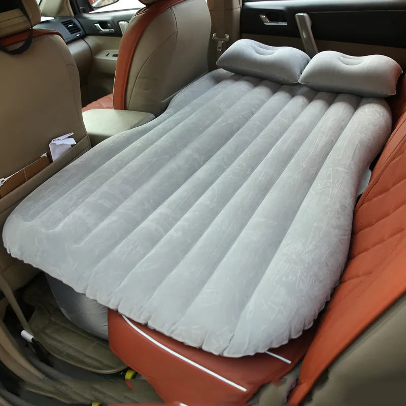 Car inflatable bed with 0.5mm flocking cloth in black wave, including pillows and pump, set up in a car rear seat