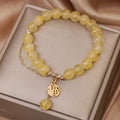 Natural stone citrine bracelet with electroplated metal and Chinese character charm on tassel for women