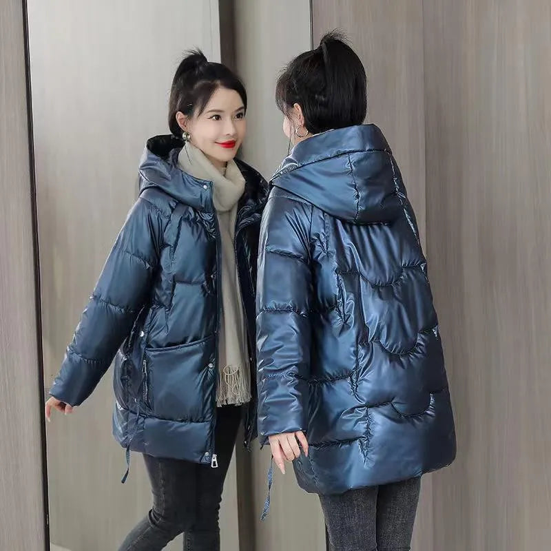 A loose-fitting, thick hooded winter jacket for women in a champagne colour, showcasing long sleeves.