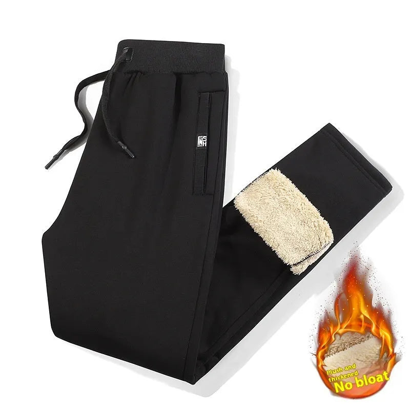 Men's grey fleece-lined oversized cotton track pants with a straight leg, shown on a hanger.