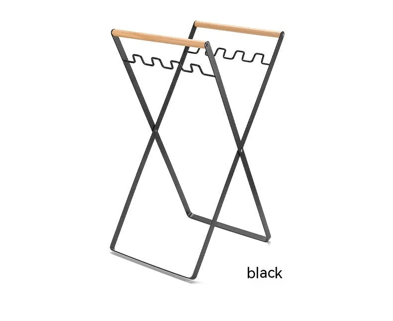 Outdoor folding garbage storage hanger with wrought iron frame and wooden handle.