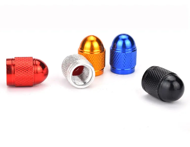Aluminium alloy mountain bike tyre valve cap shown in five colour options: black, blue, gold, red, silver.