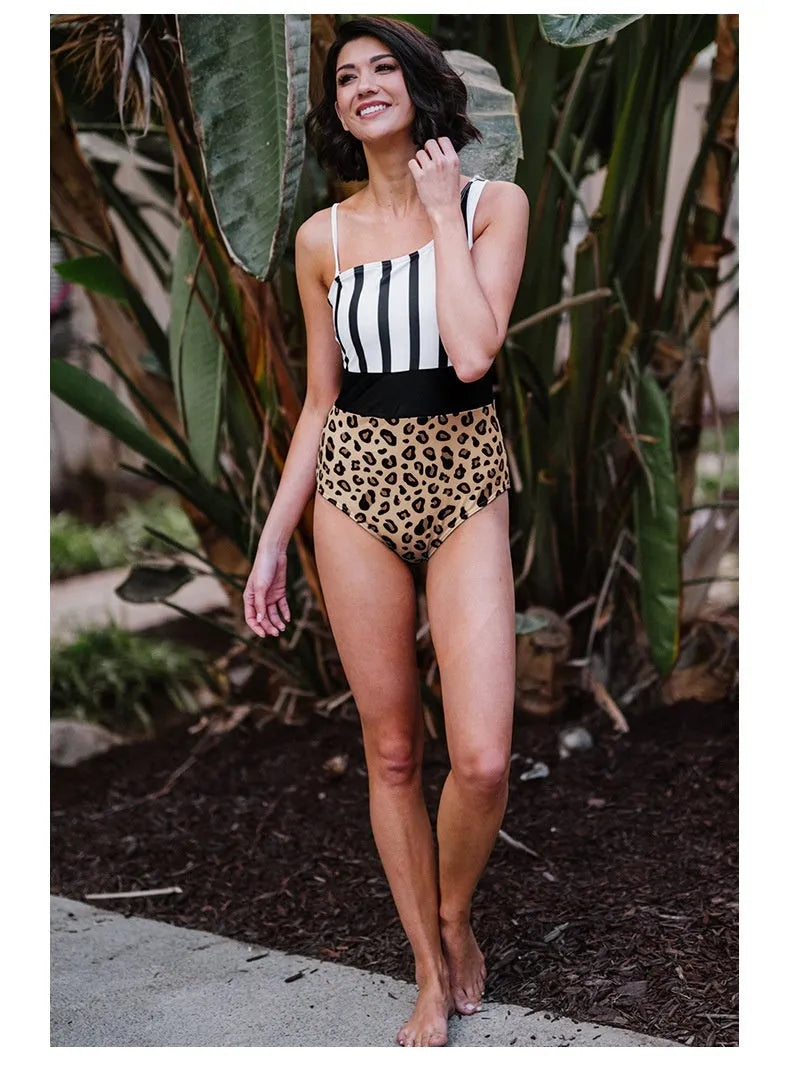 Women's leopard print one-piece swimsuit with asymmetric collar and high-waist brief design.