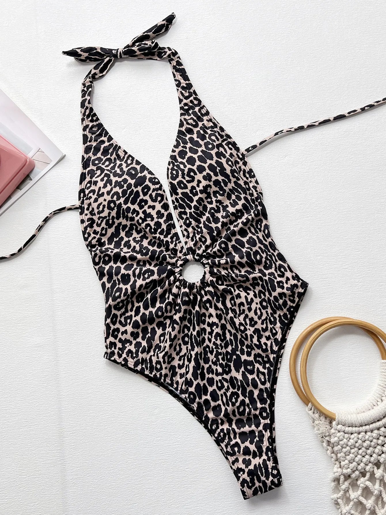 Leopard print one-piece swimsuit for women with hollow-out ring details on front.